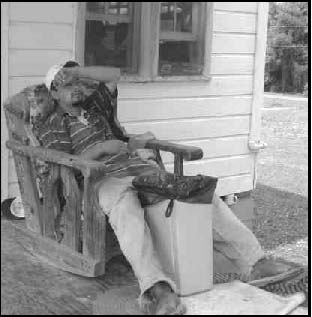 Juan on a porch resting