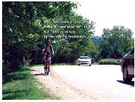 Photo of bike rider on highway