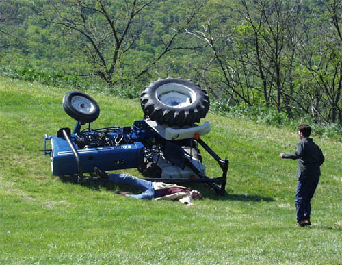 Person discovering tractor roll over accident