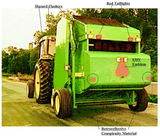 tractor with hazard flashers, red taillights, smv emblem, and retroflective conspicuity material
