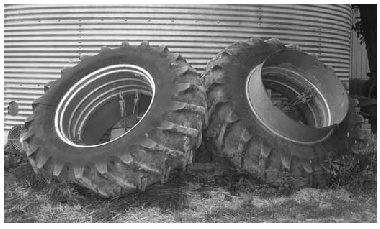 wheels leaning against silo