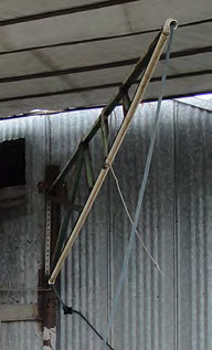 Photo: overhead swinging arm to suspend pressure washer