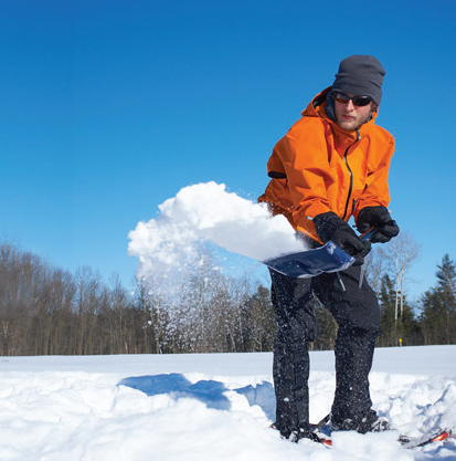 Photo of a man shoveling snow