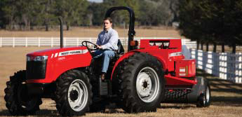 Photo of a man on a tractor with a 2 post rops