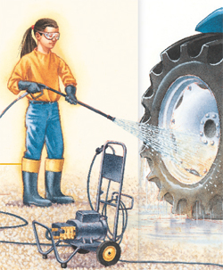 A young girl cleaning tractor tires with a pressure washer