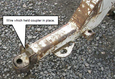Coupler and water tank trailer tongue after the incident. A piece of wire was used to replace the missing locking bolt.