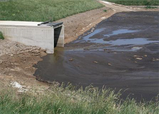 This is a picture of a non-enclosed manure storage pit.