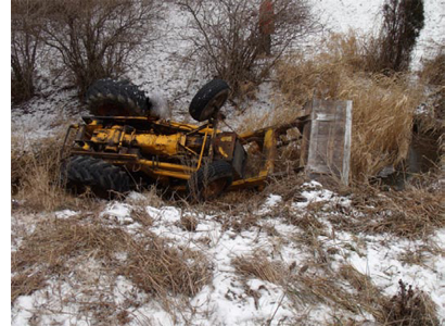 FIGURE 1. TRACTOR OVERTURNED IN DITCH