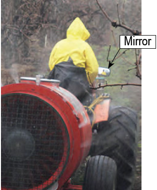 photo- appliator viewing spray in mirror