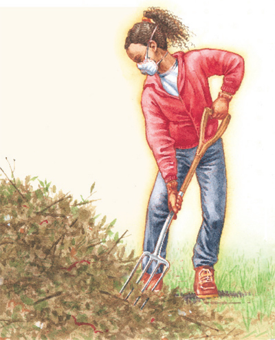 Girl shoveling compost