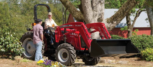 Photo of 1 man on a tractor talking to a man on the ground