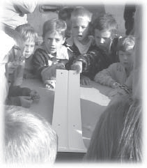 picture of students using the marbles and sloping board