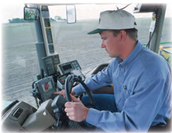 man in enclosed tractor