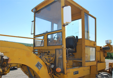 Photo of motor grader involved in incident.