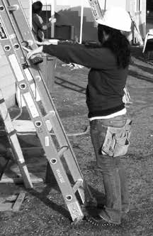 demonstration of checking the 4 to 1 ratio by standing in front of the open ladder with arms extended toward it and finger tips touching